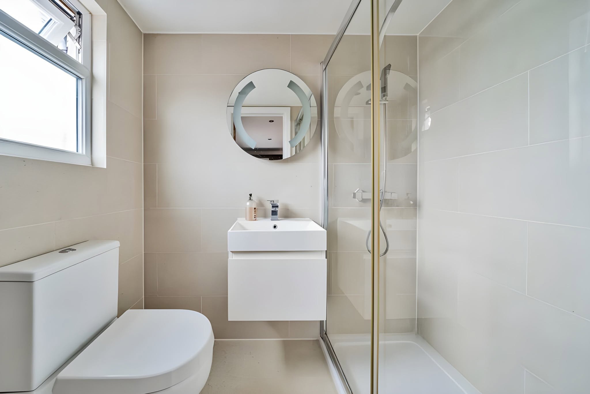Compact contemporary bathroom with walk-in shower
